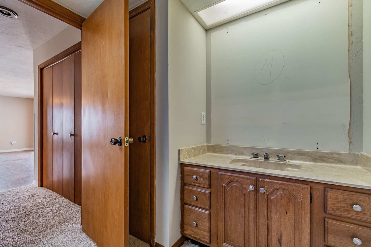before waterfront renovation bradenton ensuite vanity closet carpet