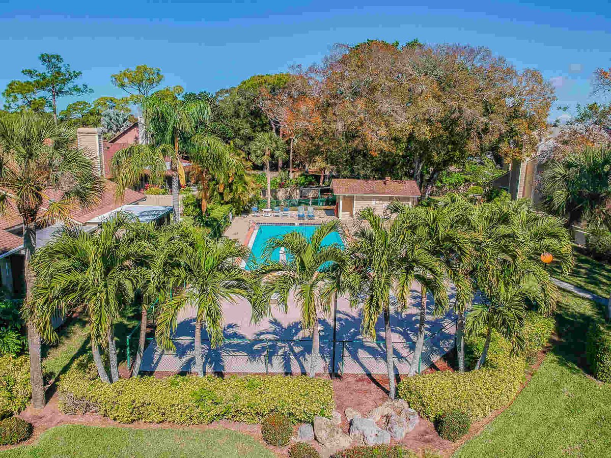 avenida madera aerial view of community pool and tennis court