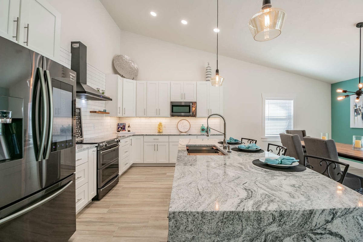 avenida madera kitchen with pendant lights and dining area