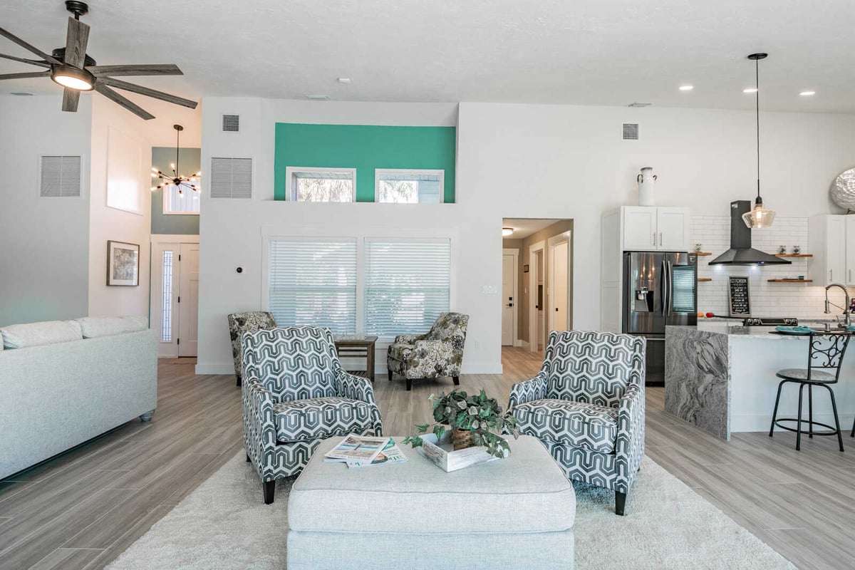 avenida madera living room with accent chairs and kitchen view
