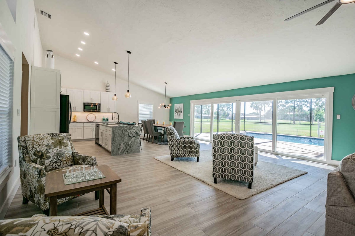avenida madera living room with chess table and pool view