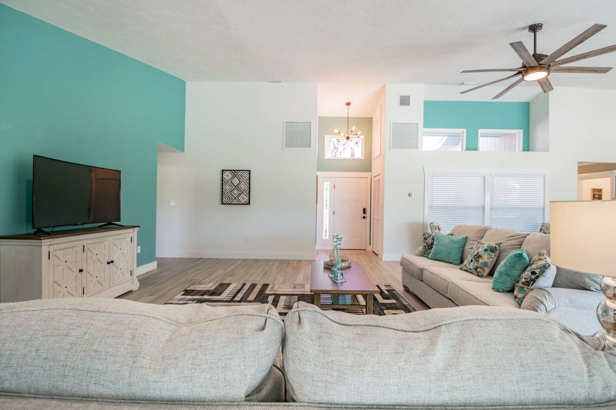 avenida madera living room with tv console and front door