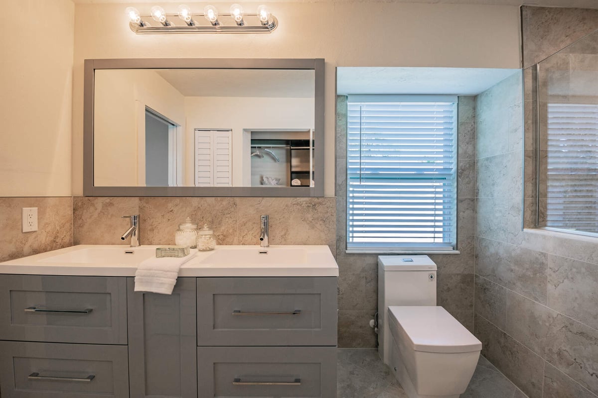 avenida madera primary bathroom double vanity and toilet