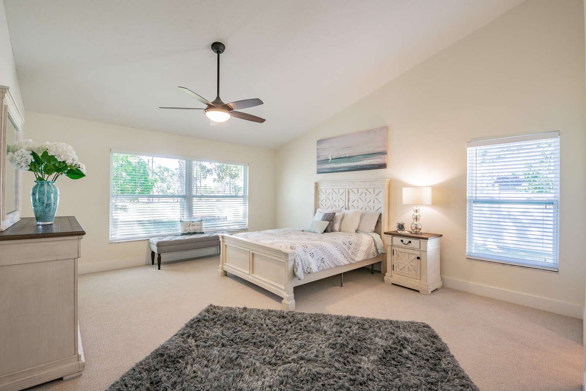 avenida madera primary bedroom with bed and window bench