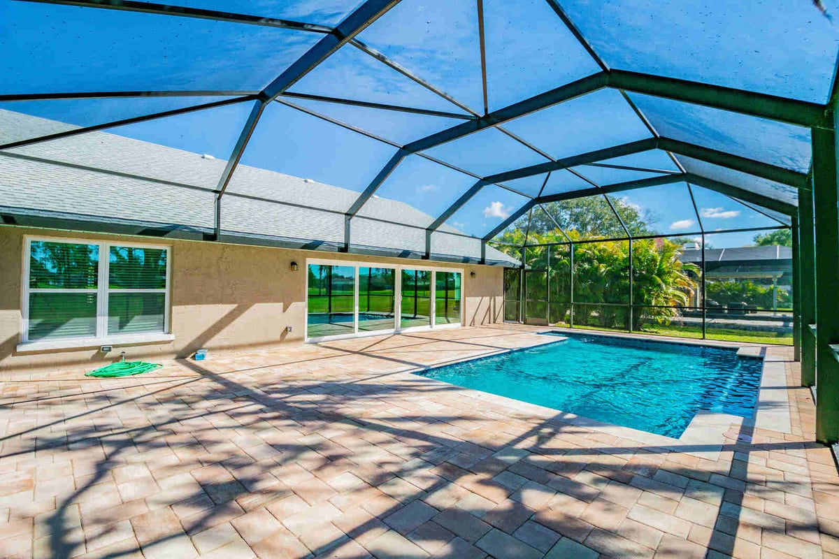 avenida madera screened pool long view with sliding doors