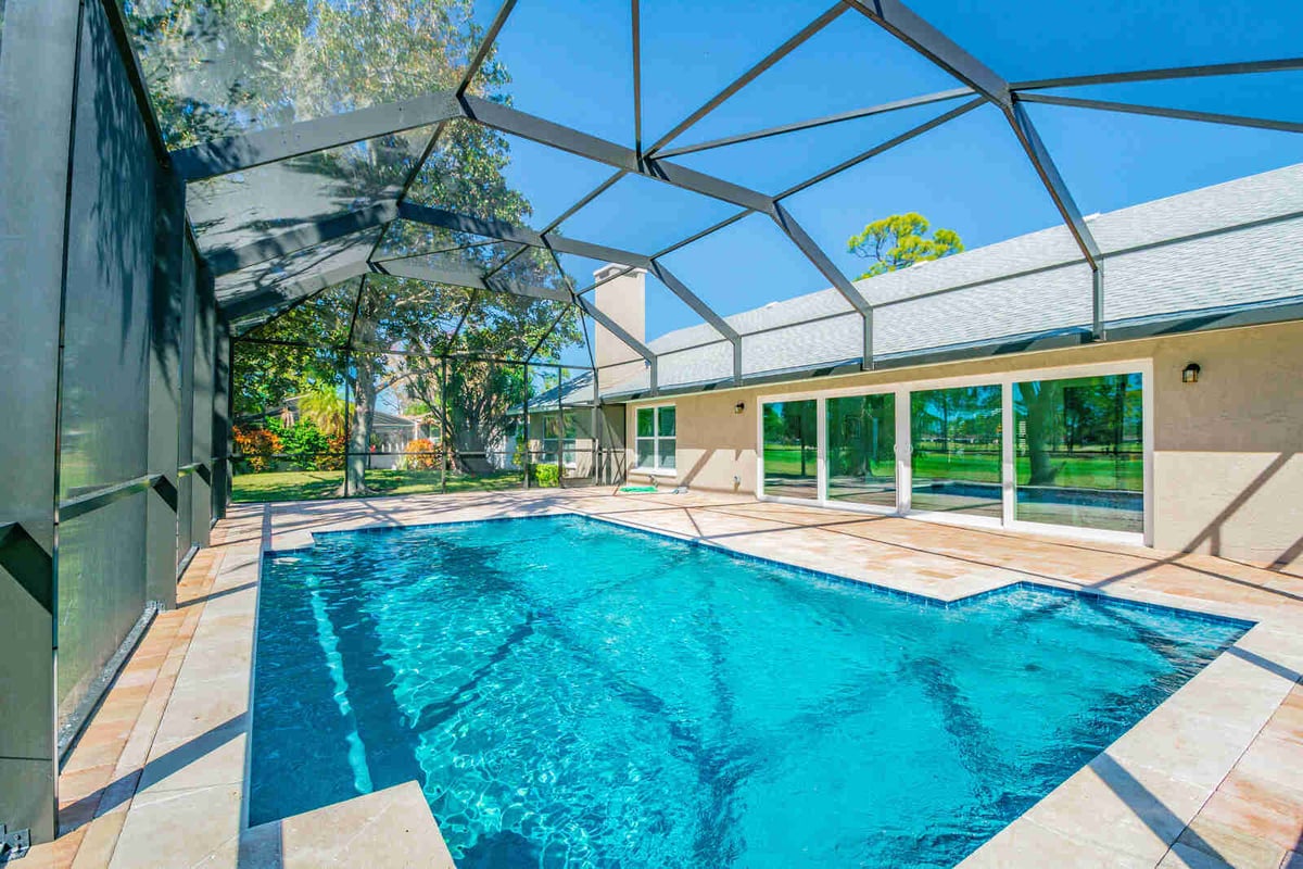 avenida madera screened pool with chimney view