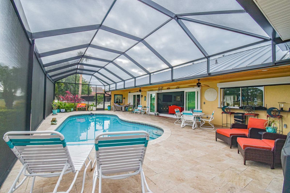 45th st west bradenton lanai pool red cushions sliding doors