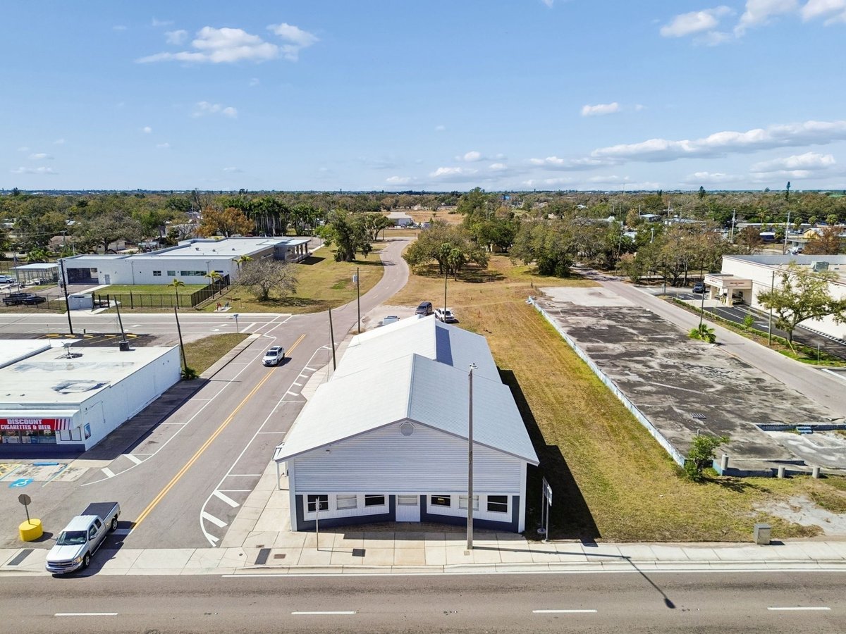 Palmetto Commercial Building Aerial Rear Angle Metal Roof Side Street Wide View