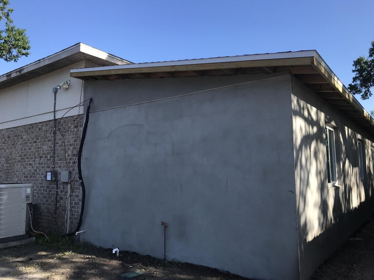 bradenton research center exterior addition corner stucco brick ac unit