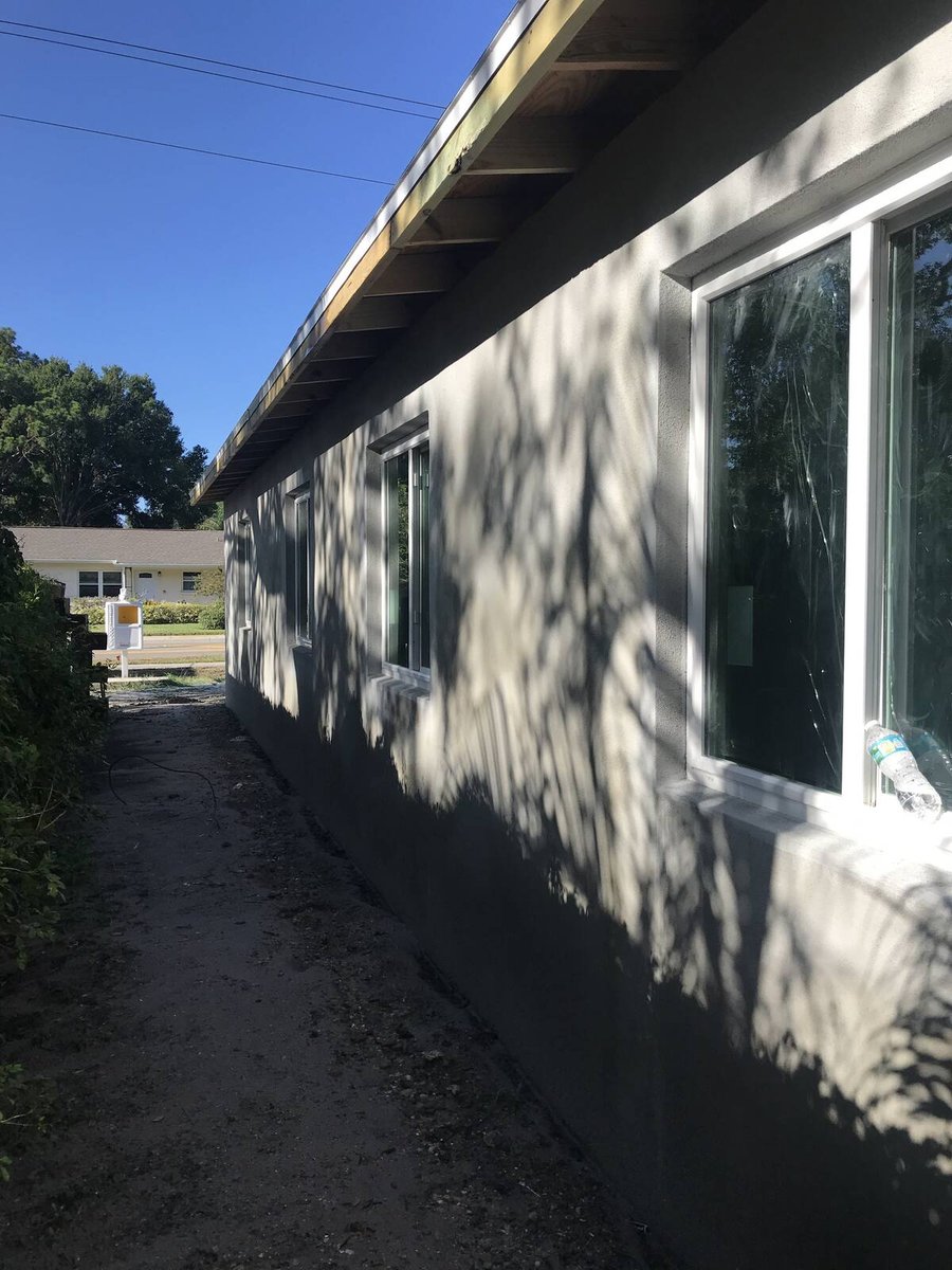 bradenton research center exterior stucco wall windows dappled shade