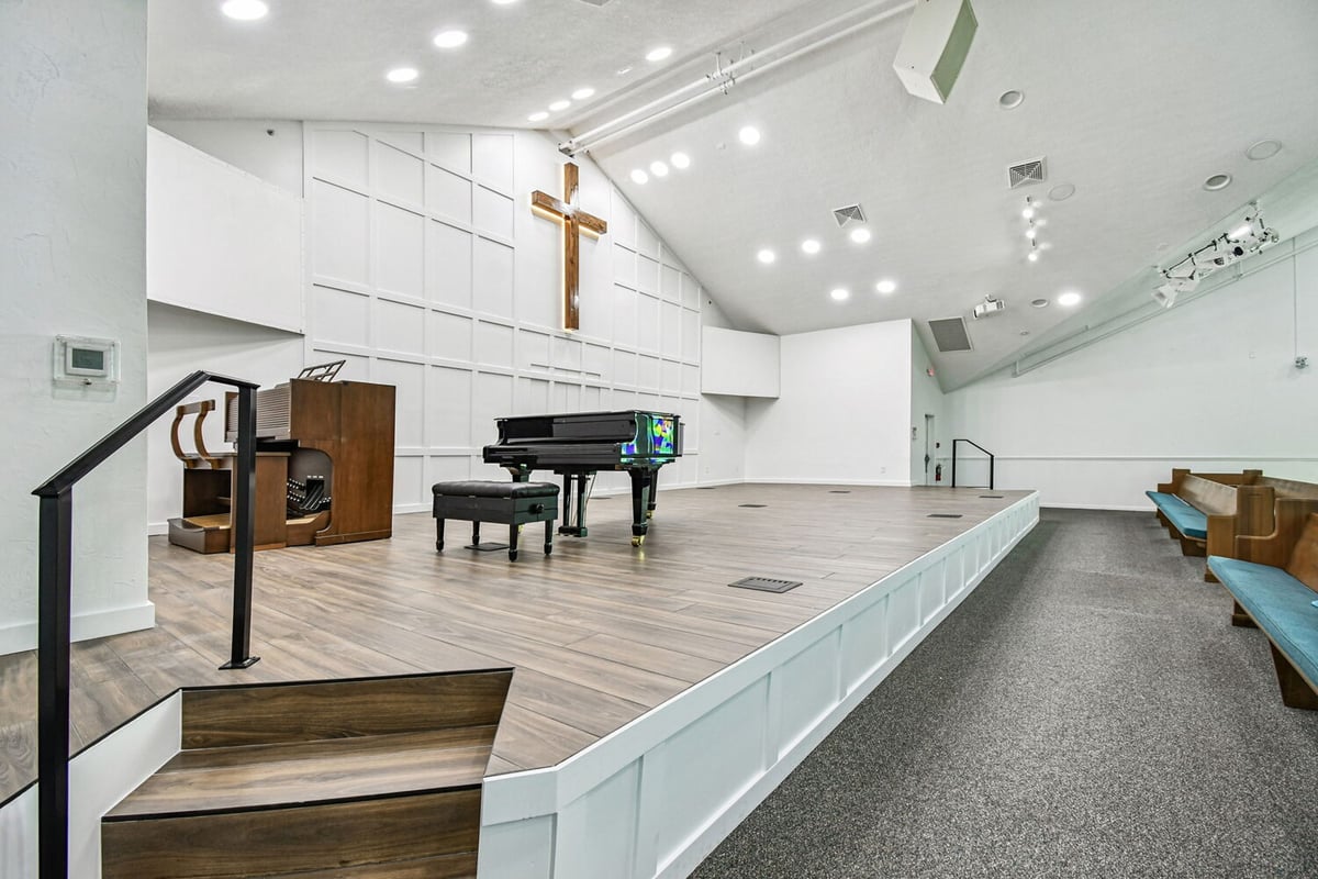 Close-up of elevated church stage with hardwood flooring by Adkins in Anna Maria, FL