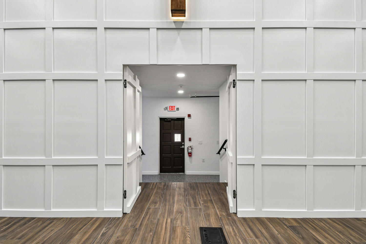 Entryway behind stage in custom sanctuary renovation by Adkins Building & Construction in Anna Maria, FL