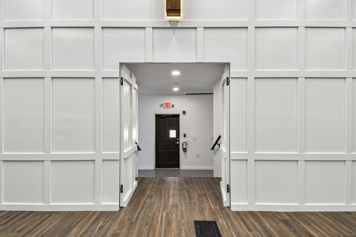 Entryway behind stage in custom sanctuary renovation by Adkins Building & Construction in Anna Maria, FL