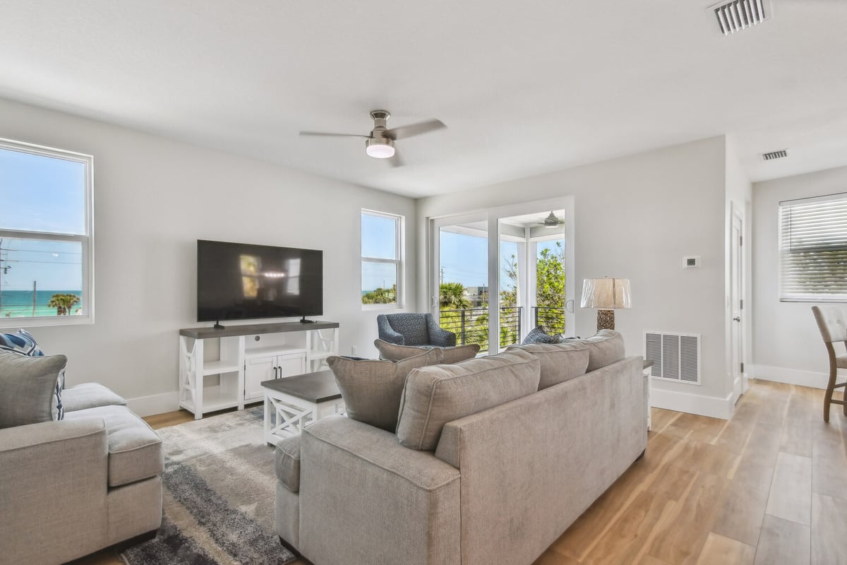 Coastal living room with ocean views in a custom home by Adkins Building & Construction in Bradenton, FL