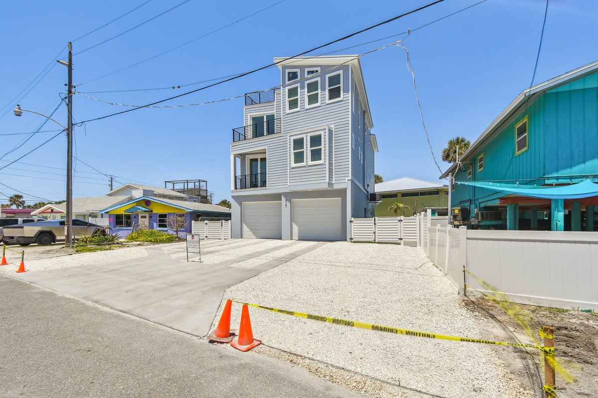 Driveway and front elevation of custom home by Adkins Building & Construction in Bradenton, FL