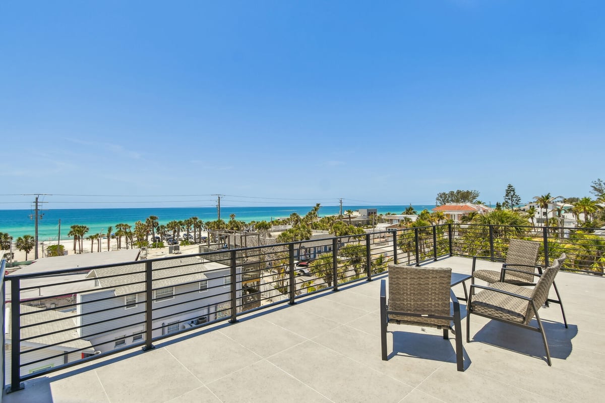 Rooftop patio with panoramic Gulf views in Bradenton Beach custom home by Adkins Building & Construction