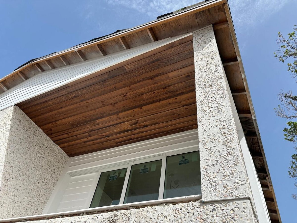 Framed concrete block home with installed windows by Adkins Building & Construction in Longboat Key, FL.