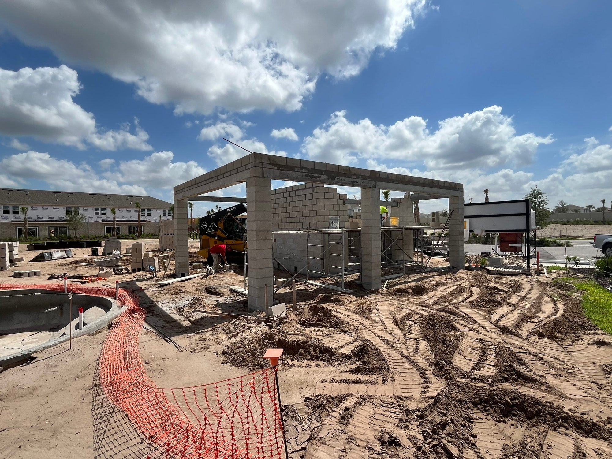 Adkins custom home building site with concrete blocks and structure