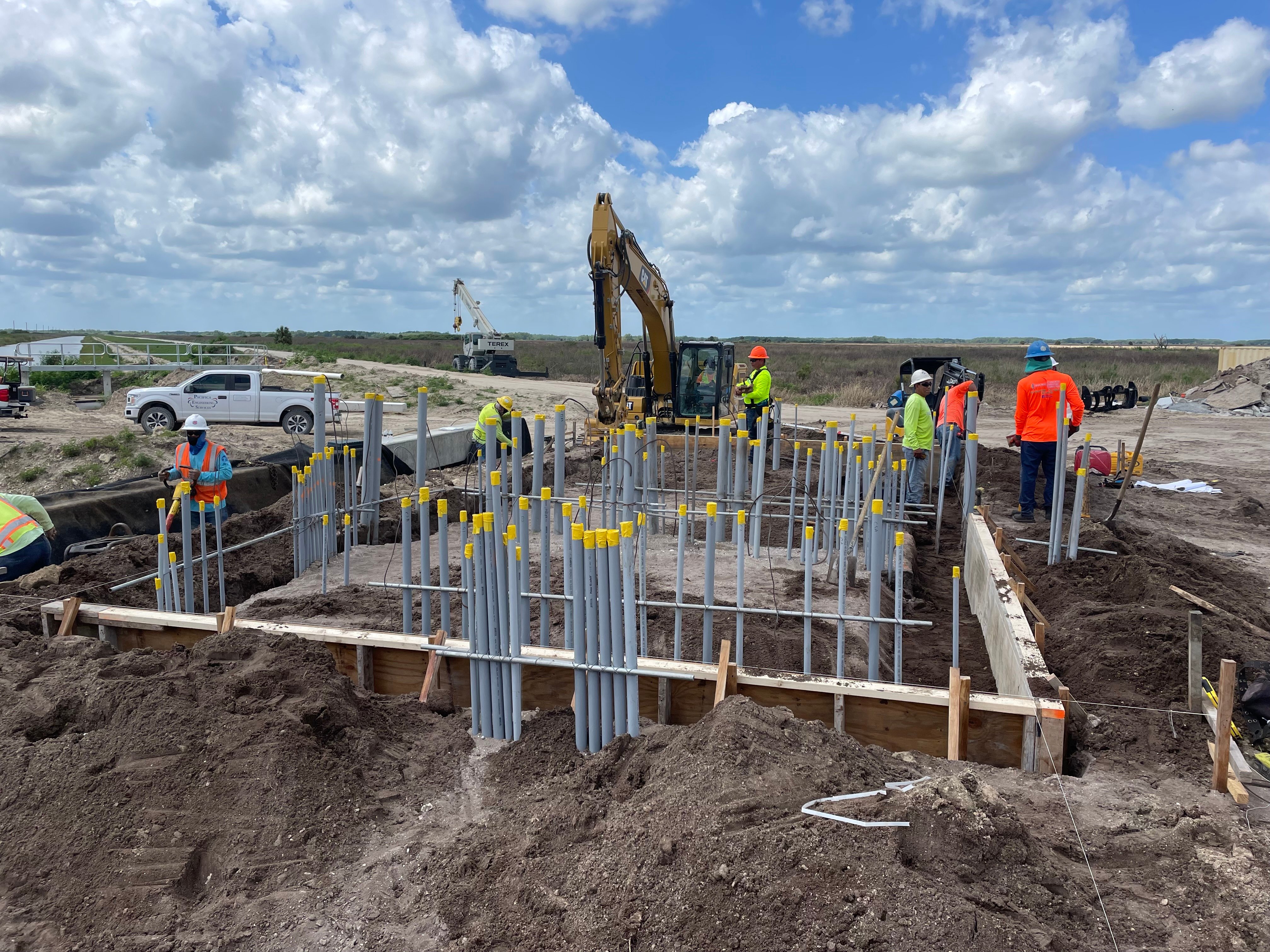 custom home building construction site featuring concrete framing