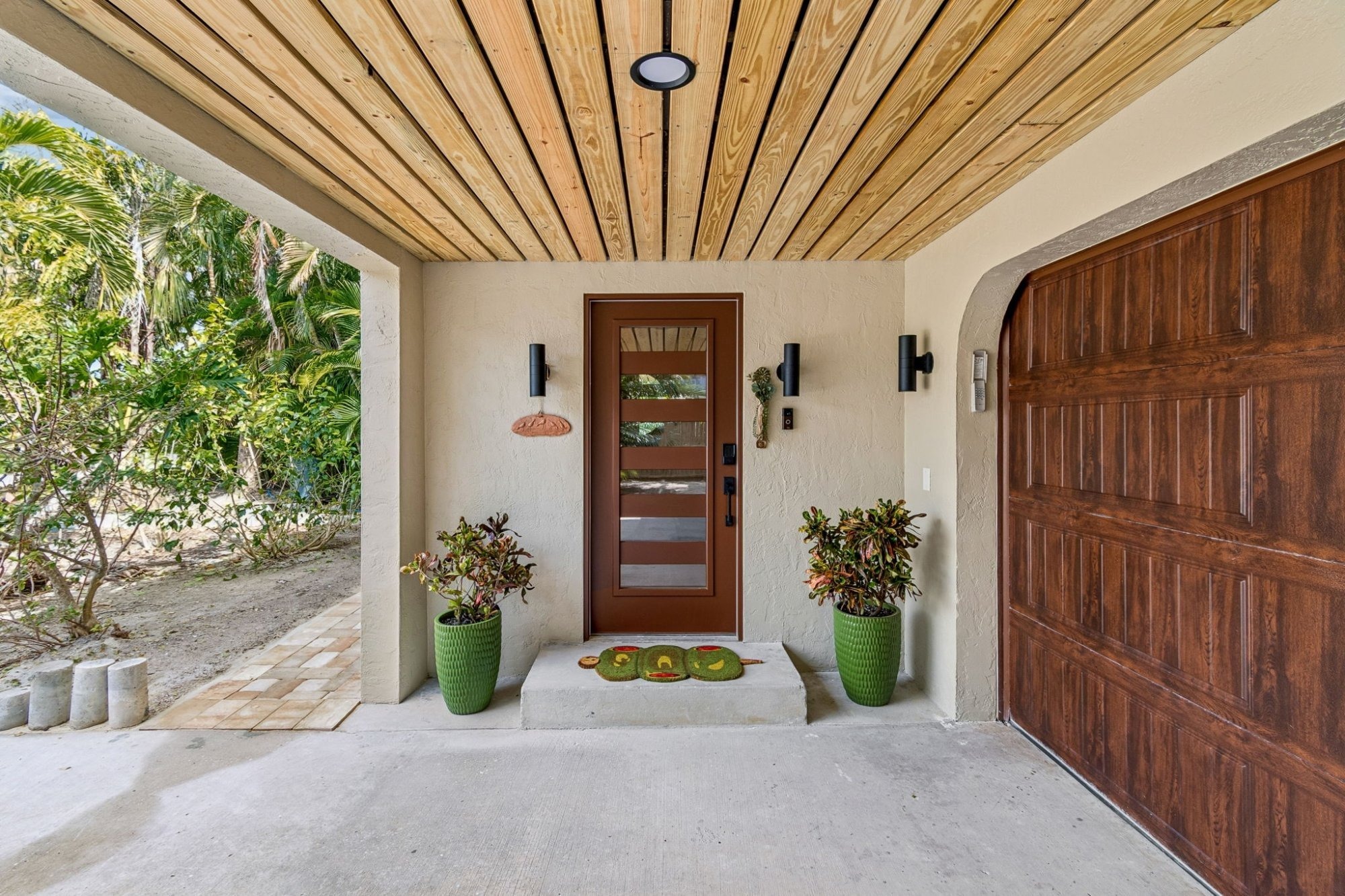 Exterior_Covered_Entry_Wood_Ceiling_Modern_Front_Door_Glass_Panel_Wall_Sconces