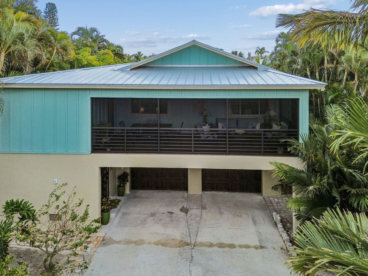 Exterior Front Facade Teal Board Batten Metal Roof Double Garage