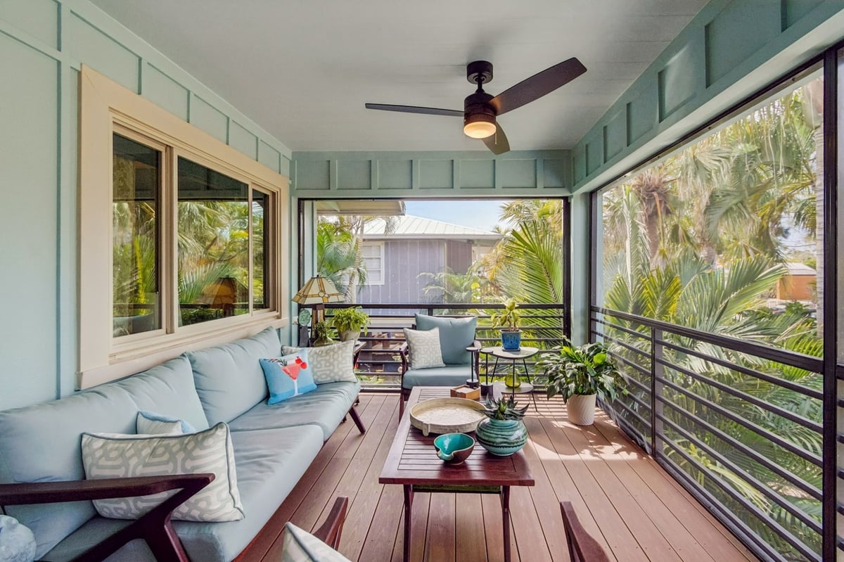 Exterior Screened Porch Sitting Area Blue Sofas Ceiling Fan