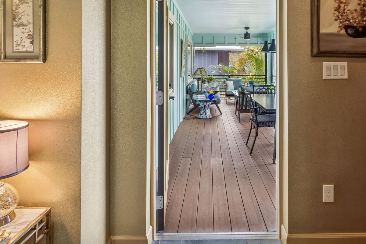 Interior Hallway View Through Door To Screened Porch Teal Walls Wood Deck