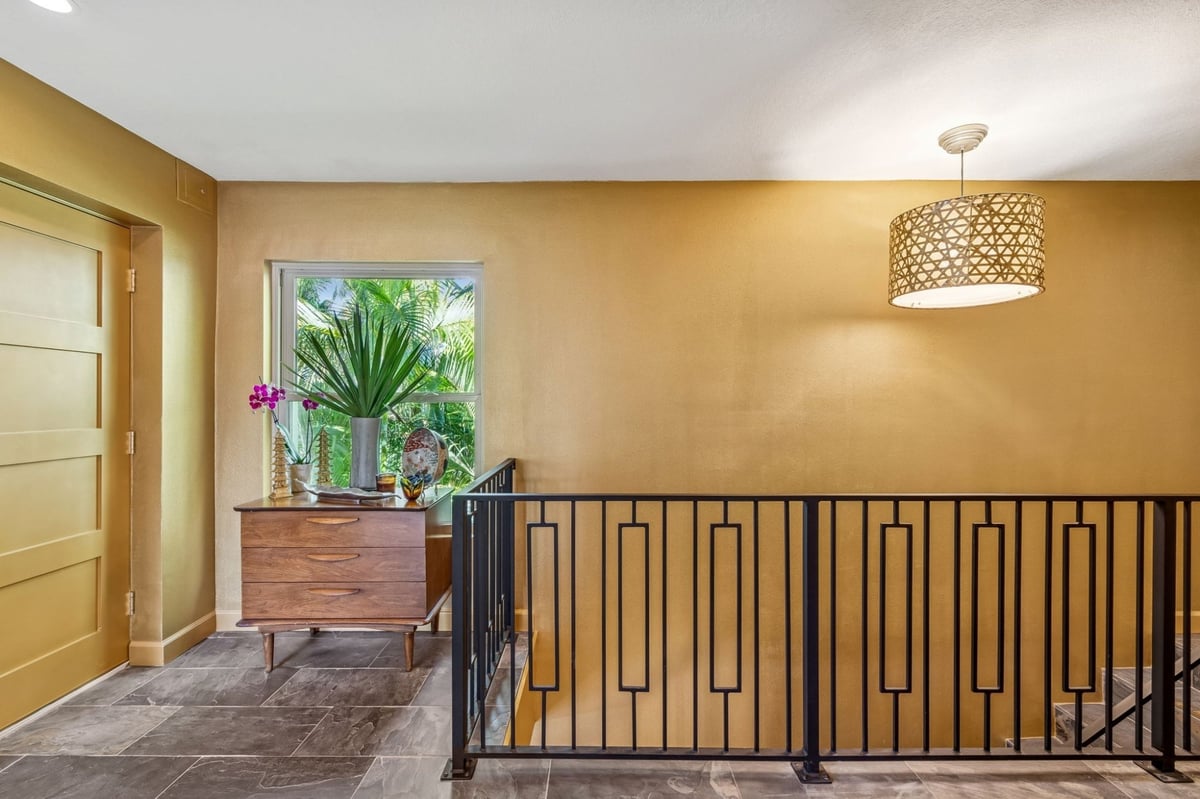 Interior Upper Landing Gold Accent WallI Iron Railing Woven Pendant