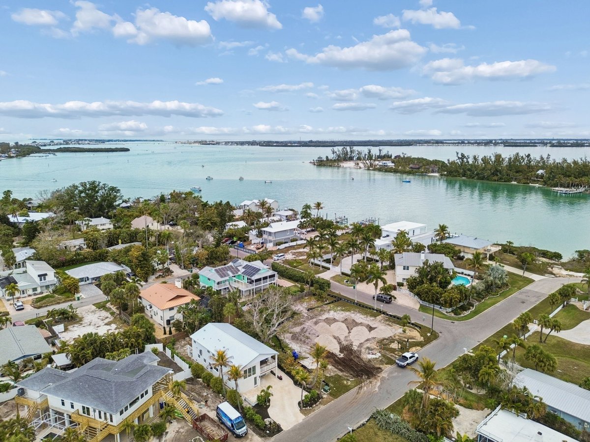 Aerial Drone View Coastal Neighborhood Waterway Turquoise Water Palm Trees