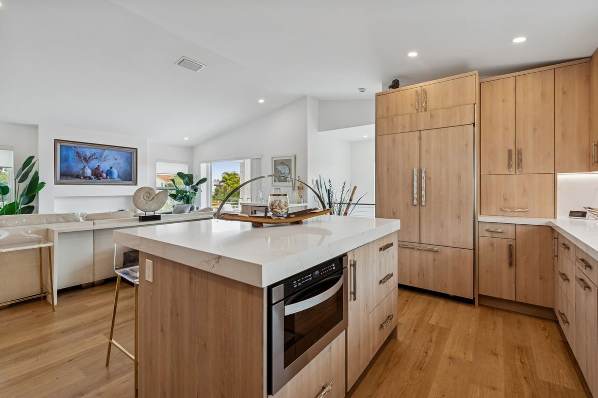 Interior Kitchen Island Microwave Drawer Quartz Countertop Open To Living Room