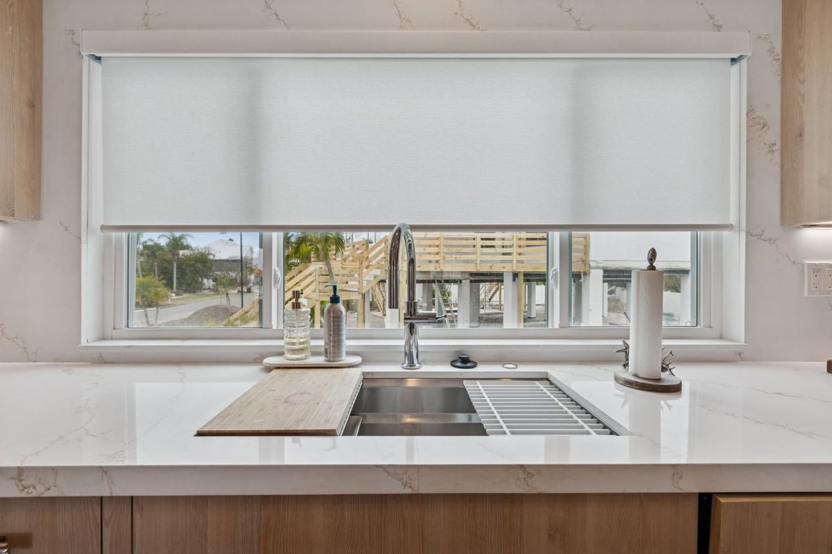 Interior Kitchen Sink Closeup Stainless Undermount Quartz Countertop Roller Shade