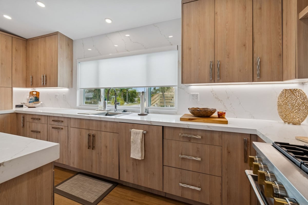 Interior Kitchen Sink Wall Wood Cabinets Quartz Backsplash Under Cabinet Lighting