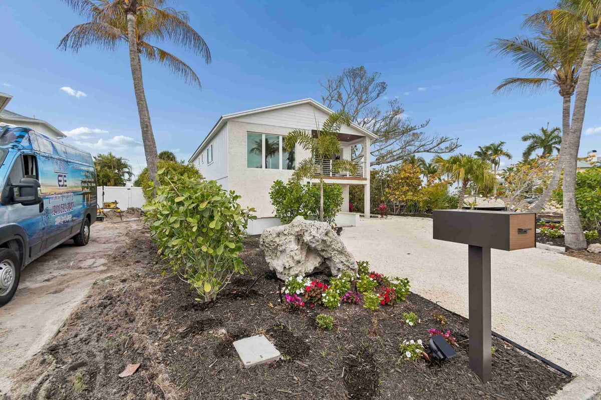 longboat key new home construction street view palm trees mailbox