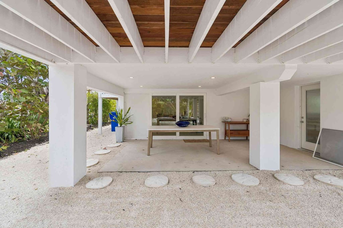 longboat key new home under house outdoor living wood beam ceiling
