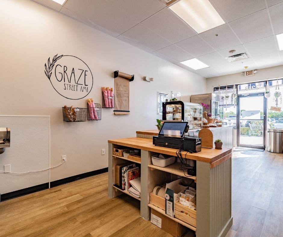 graze street ami checkout counter logo wall