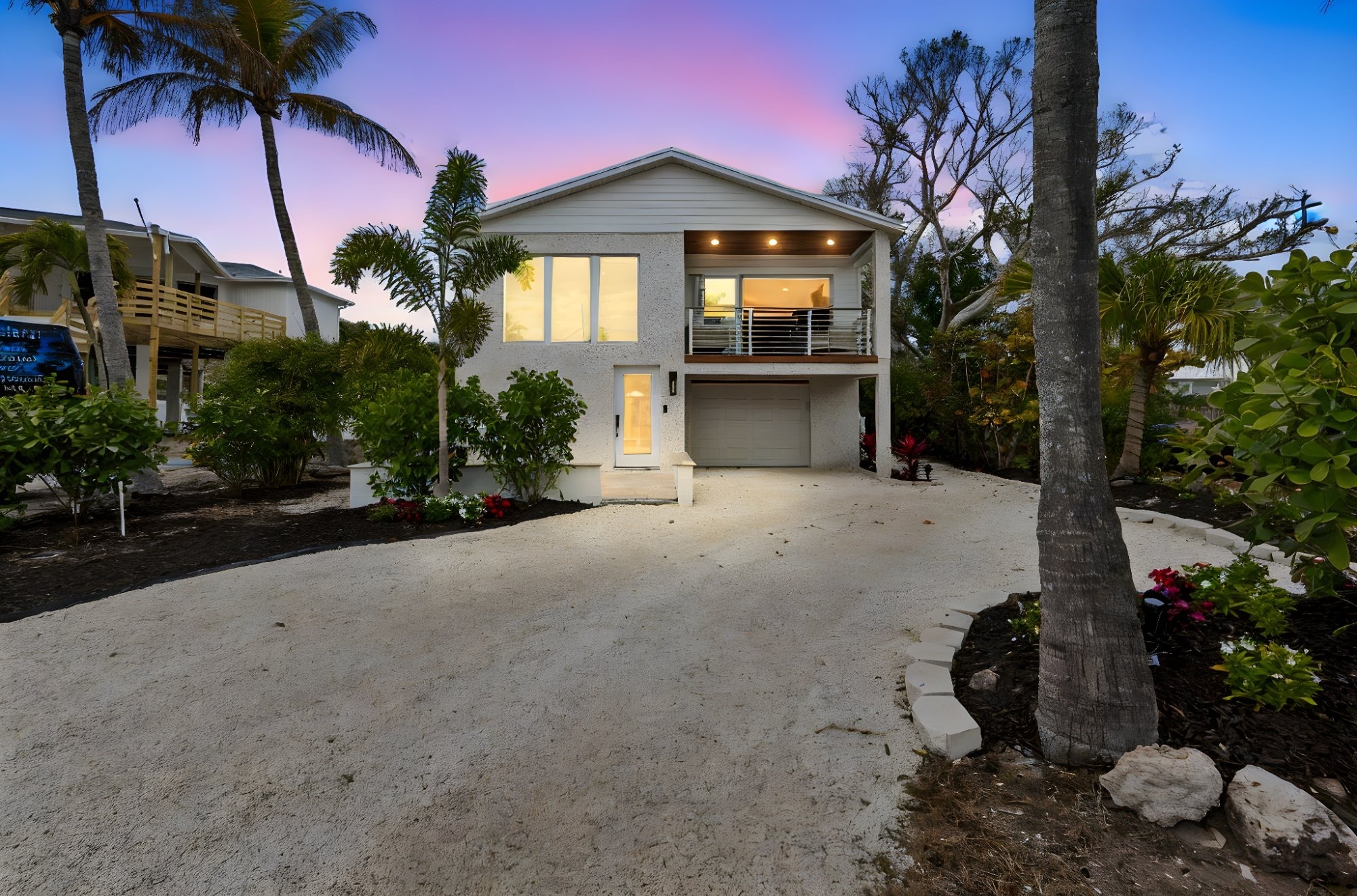 Coastal_Home_Exterior_Dusk_Two_Story_White_Stucco_Palm_Trees_Sunset_Sky